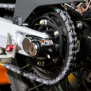 EasyBlock compatible with Aprilia Tuareg 660cc motorcycle, showing the sleek black EasyBlock device mounted on the bike.