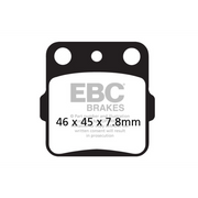EBC Brakes off-road motorcycle TT Hybrid Carbon brake pad with FA084/2TT label, showing black carbon material and metallic backing plate.