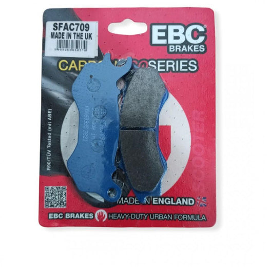 EBC Brakes Scooters Carbon Brake Pad SFAC709 installed on a scooter brake caliper, showing the black carbon brake pad material.