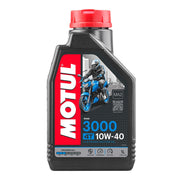 Motor oil bottle labeled Motul 3000 10W40 4T, 1-liter container with Motul branding and product details visible.