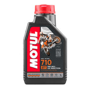 Motul 710 2T 1L motorcycle two-stroke engine oil bottle with label and cap visible.