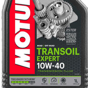 Motor oil bottle labeled MOTUL Transoil Expert 10W40 1L, featuring gear icons on the label for automotive transmission fluid.